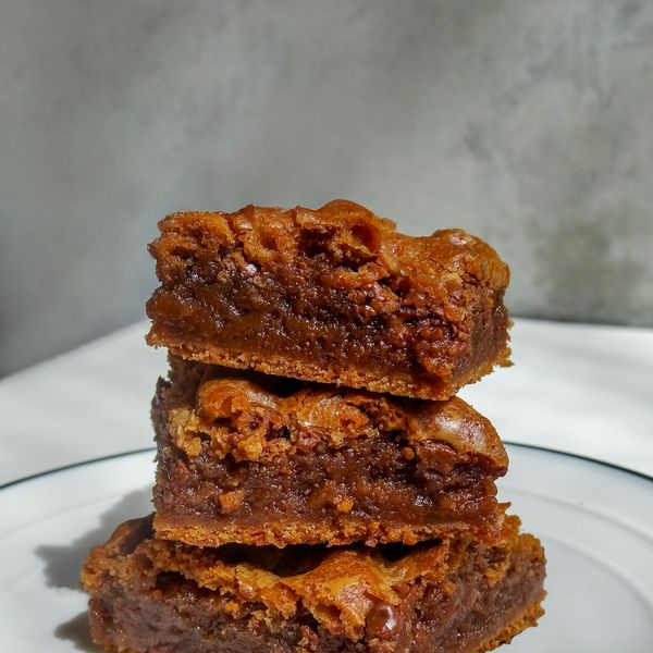 Blondies stacked on a plate